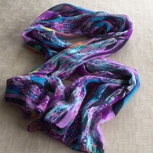 Women’s multicolored 100% polyester shear scarf. Gently worn.